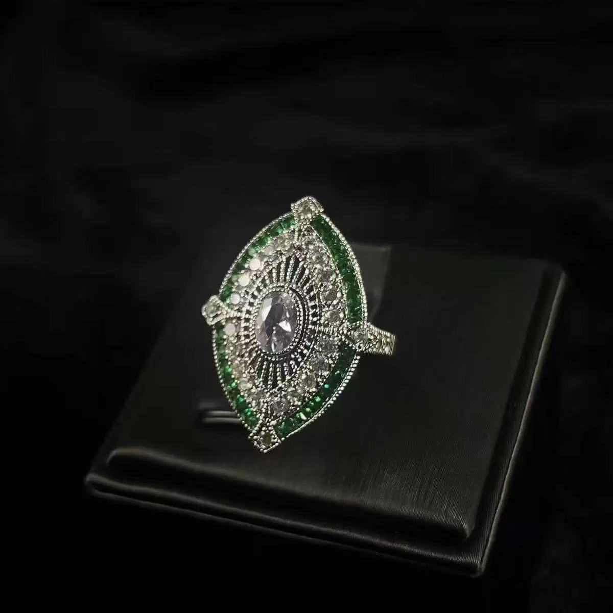 Court-style emerald ring